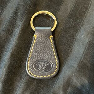 Navy blue Dooney & Bourke key chain. Excellent condition - new without t…